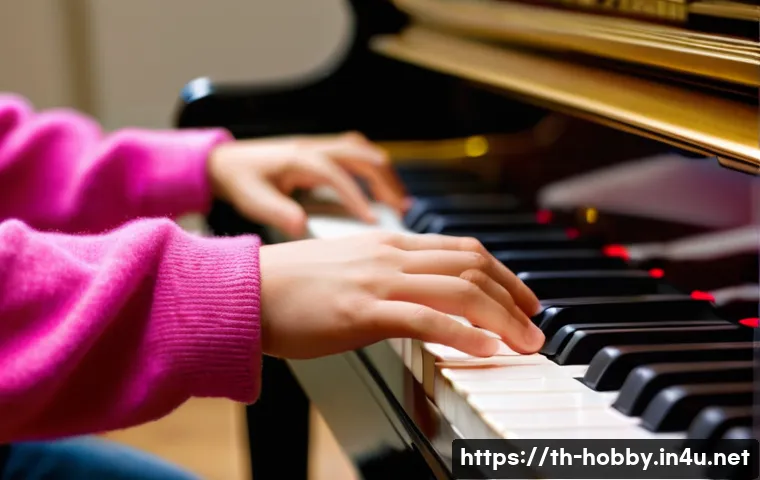 피아노 연주 팁 - A close-up of a teenager's hands (wearing casual, comfortable clothes with sleeves covering arms) gr...